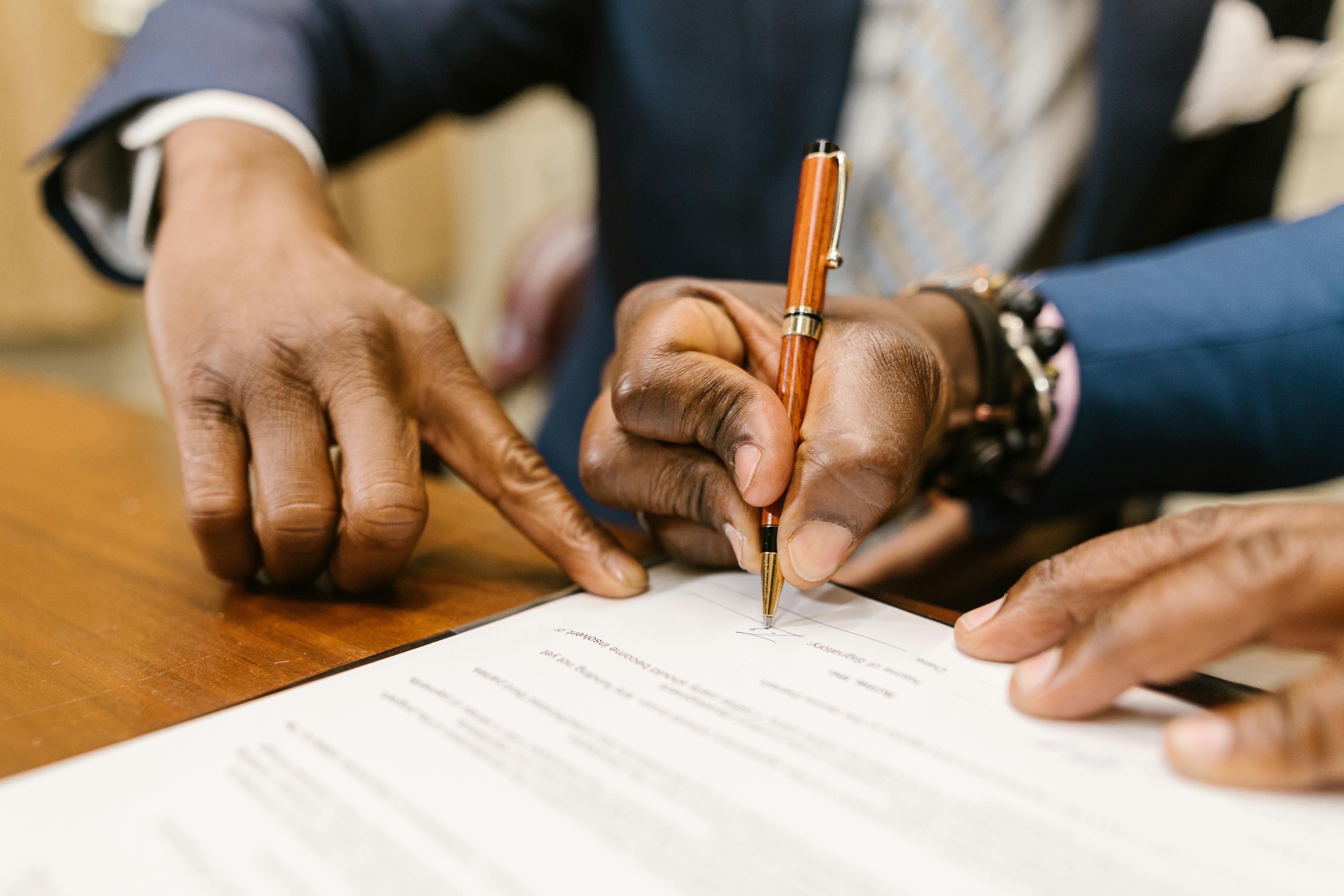 Professional signing an insurance contract
